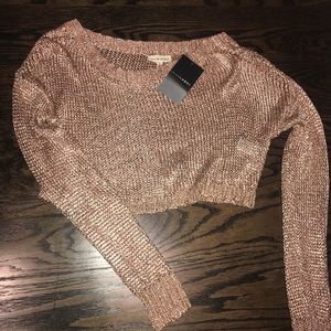 Rose gold mesh crop top.